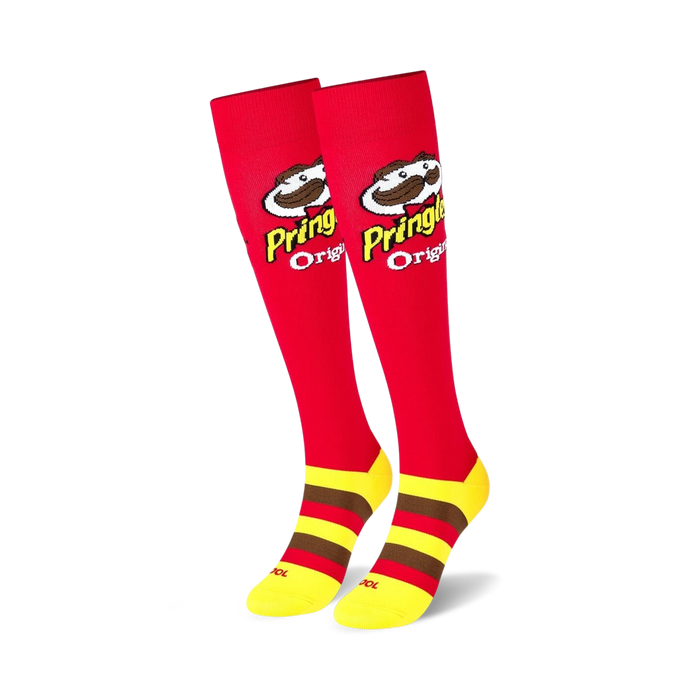 red knee high socks with a yellow and brown striped section at the top. features a pattern of the pringles logo with the pringles mascot, julius pringles.  