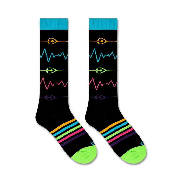 A pair of black socks with a colorful pattern of sound waves on the front. The socks have a green toe and heel, and the top cuff is blue.