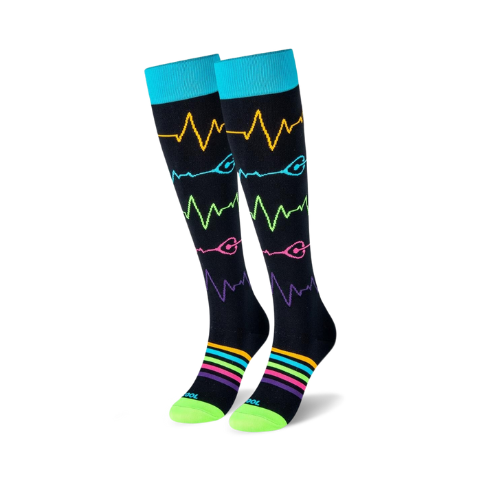 ekg-patterned knee-high socks in blue and green with a yellow, green, blue, and pink heart and ekg wave pattern, made for men and women, for a medical theme.  