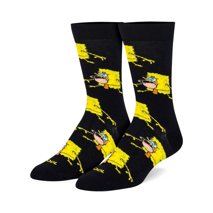 Pair of black crew socks with a repeating pattern of yellow Spongebob Squarepants in a prehistoric pose.