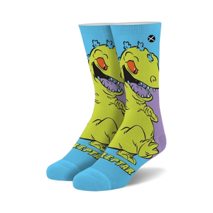 Crew socks featuring Reptar from Rugrats.  Yellow and purple Reptar design on a light blue background.