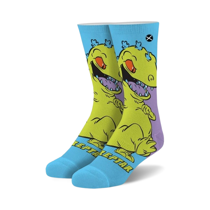 Crew socks featuring Reptar from Rugrats.  Yellow and purple Reptar design on a light blue background.