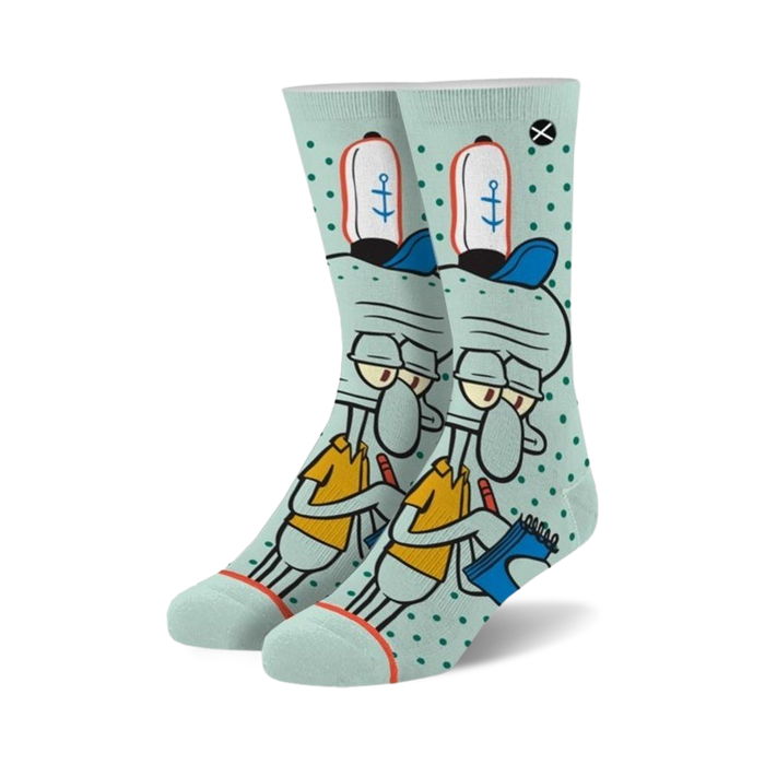 Crew socks in teal and white featuring Squidward Tentacles from Spongebob Squarepants. He's in his work uniform, holding a notebook, on a teal background with white polka dots.