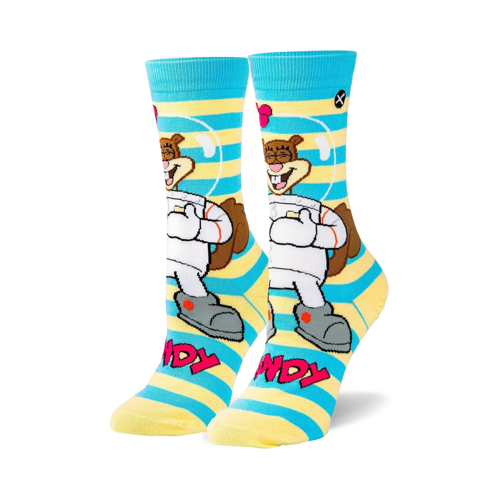Crew socks in blue and yellow stripes featuring Sandy Cheeks in a spacesuit.  The design includes her smiling face and the words 'Sandy'.