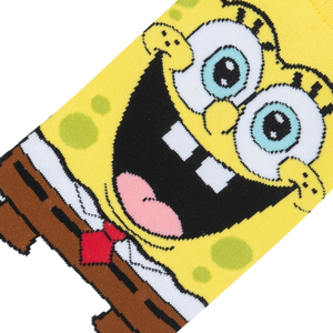 Close-up detail shot of Spongebob's smiling face on the socks, highlighting the vibrant colors and intricate design.