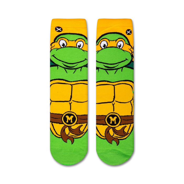 Flatlay showcasing a pair of TMNT Michelangelo crew socks, highlighting the design detail from the top.