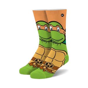Crew socks featuring Michelangelo from TMNT. Green, orange, and brown colors.  Mikey's face and shell are prominently displayed.