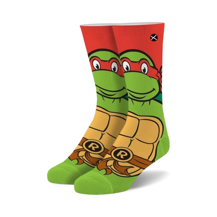 Crew socks featuring Raphael from TMNT. Red, green, and yellow design with Raphael's face and shell.