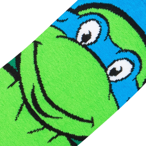 Close-up detail shot of Leonardo's face on the TMNT socks, showing the intricate knit design.