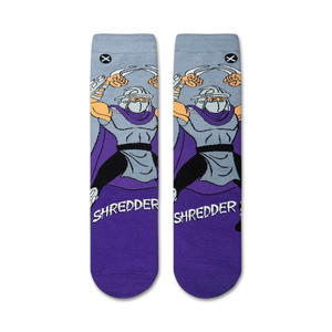 Flatlay showcasing a pair of TMNT Shredder crew socks, purple and grey.