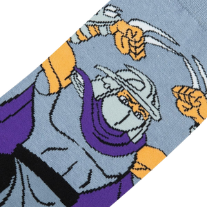 Close-up detail shot of the TMNT Shredder sock design, highlighting Shredder's face and sais.