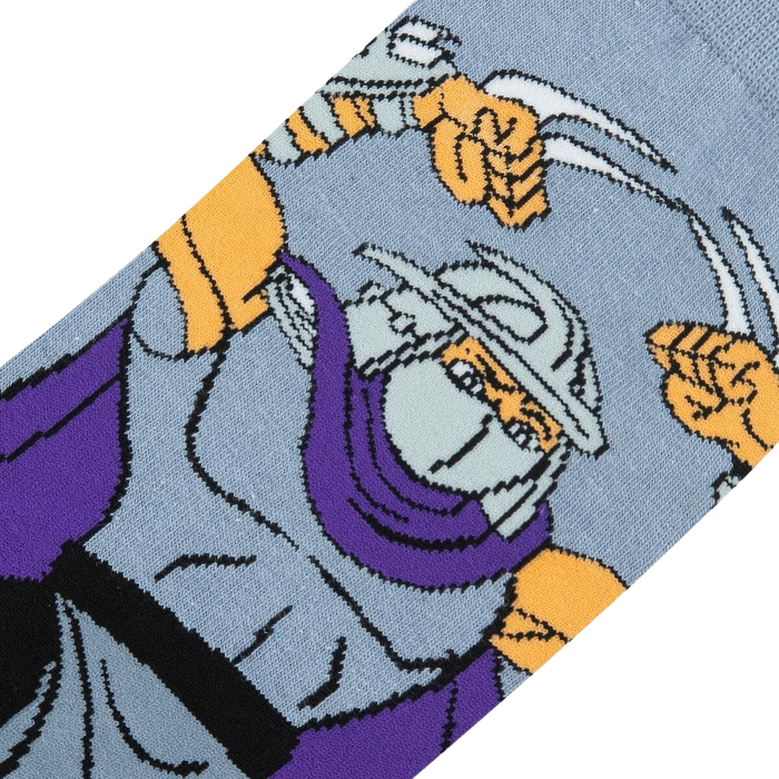 Close-up detail shot of the TMNT Shredder sock design, highlighting Shredder's face and sais.