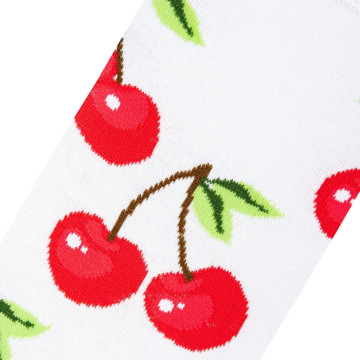 Close-up detail shot highlighting the vibrant red cherries and crisp white background of the socks.