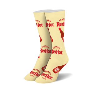 Pair of cream-colored crew socks with repeating Frank's RedHot logo and bottle illustrations. Red and cream color scheme.