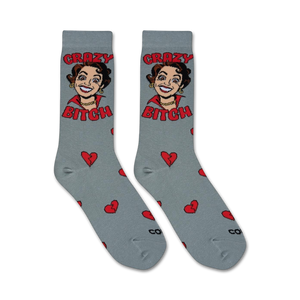 Flatlay product shot showing two 'Crazy Bitch' socks laid flat, showcasing the full sock design and pattern.
