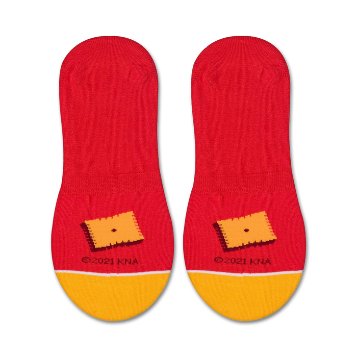 A red sock with a yellow toe and heel. The word 