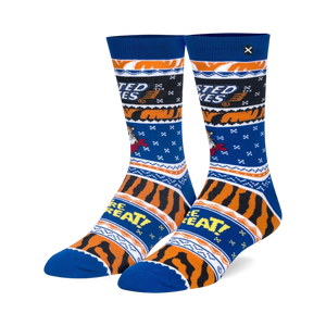 Pair of blue and orange crew socks. Frosted Flakes themed design features Tony the Tiger and 'They're Grrreat!' text.