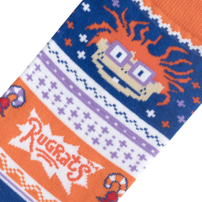 Close-up detail shot of the Chuckie Ugly Sweater socks, highlighting the Rugrats logo and Chuckie's face.
