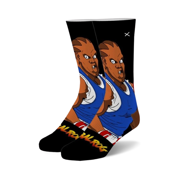 Pair of black crew socks with a graphic of Balrog from Street Fighter 2. The main colors are black, blue, and brown. Balrog's name is written in flames on the bottom. }}
