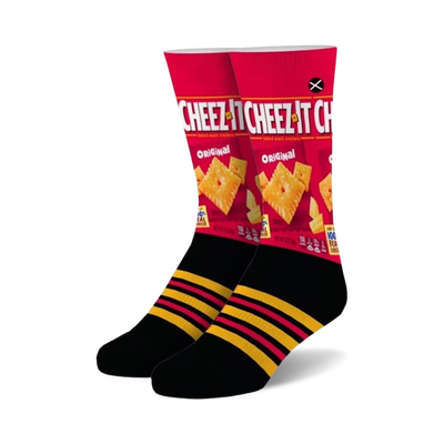 Pair of crew socks showcasing a Cheez-It box design. Red, black, and yellow are the main colors. Features black stripes on the cuff.
