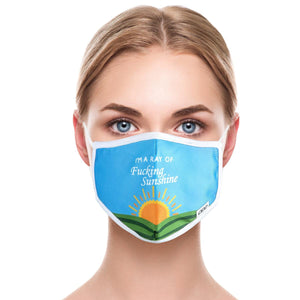A young woman is wearing a blue and white facial mask. The mask has the words 