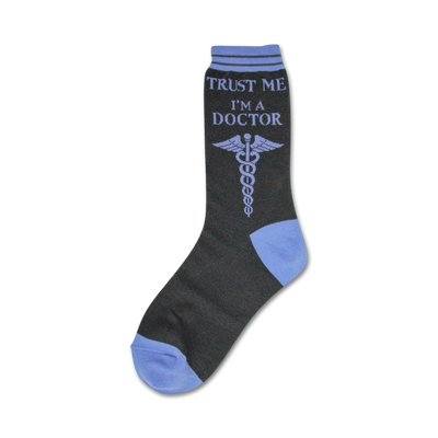 Crew socks in dark gray with a light purple caduceus and the text 'Trust Me I'm A Doctor.' The toe and cuff are light blue.