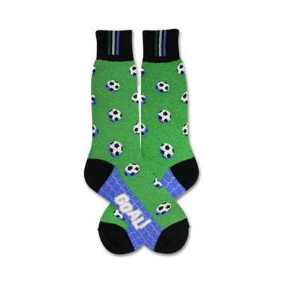 A pair of crew socks with a green field design, scattered soccer balls, and a 'Goal!' detail on the bottom. The socks are black and green with light blue accents.