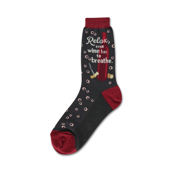 Crew socks in dark gray with maroon accents. Design includes a wine bottle, corkscrew, corks, and the text 'Relax, even wine has to breathe'. }}