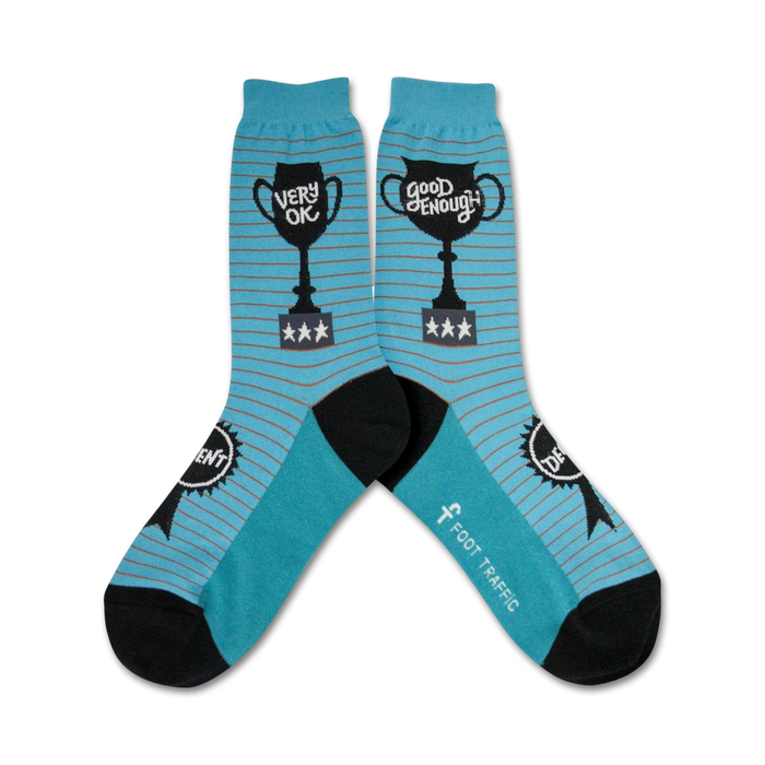Pair of teal blue and gray striped crew socks. Each sock features a black trophy graphic with 'Very Ok' or 'Good Enough' and stars. }}
