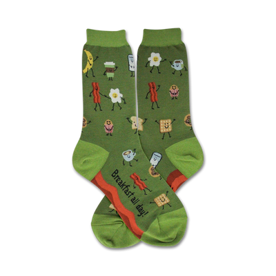 Pair of women's green crew socks. Features a whimsical design of dancing breakfast foods like bacon, eggs, coffee, and toast in red, orange, and white.