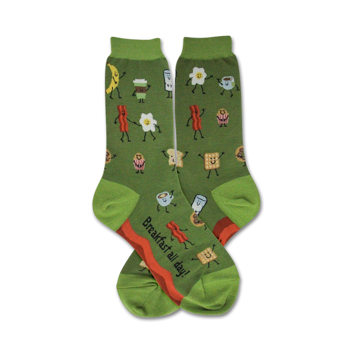 Pair of women's green crew socks. Features a whimsical design of dancing breakfast foods like bacon, eggs, coffee, and toast in red, orange, and white. }}