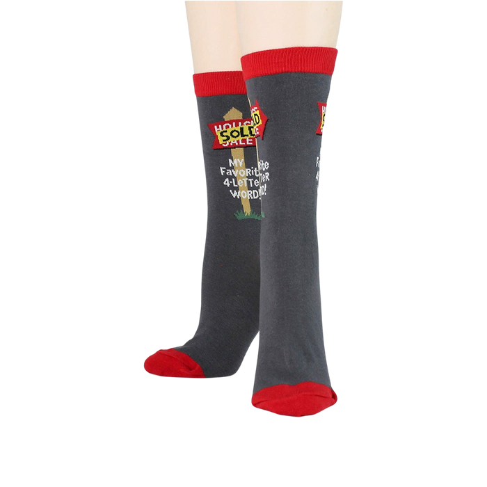 Flatlay showcasing a pair of 'Realtor' socks, highlighting the design detail.