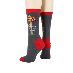 Close-up view of the 'Realtor' socks, focusing on the 'House Sold' graphic.