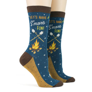 Pair of 'Let's Have S'more Fun!' socks on a model's feet.