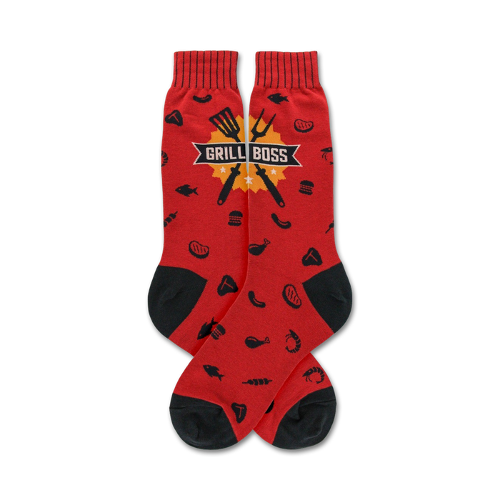 Pair of red crew socks with a black BBQ grill utensil design and food icons. 'Grill Boss' is printed on a yellow banner. }}