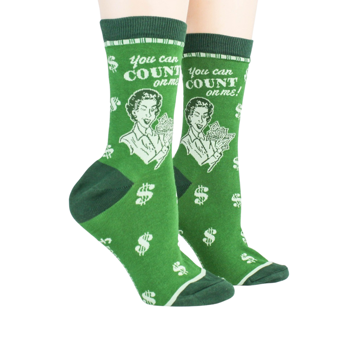 Lifestyle shot showing a pair of green 'Accountant' socks on a person's feet.