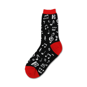 Close-up of a black crew sock with white musical notes and a red cuff.  'Dancing Notes' sock design.