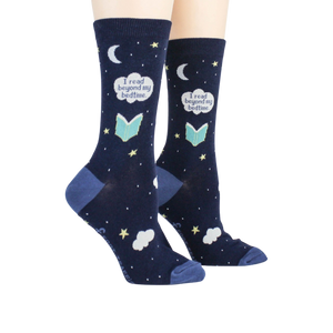 Lifestyle shot showing the socks on a person's feet.  The socks are navy blue with a whimsical design.