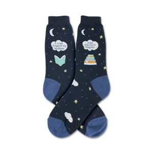Pair of navy blue crew socks. Features a whimsical design of stars, clouds, crescent moons, and text that says