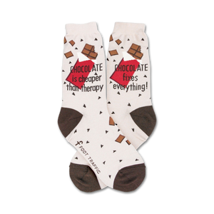 Cream crew socks with brown heel and toe. Features chocolate bar graphics and the text 'Chocolate is cheaper than therapy' and 'Chocolate fixes everything!'