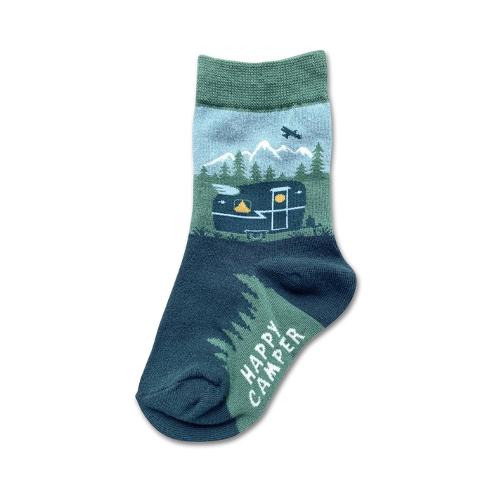 kids' dark blue crew socks with a green cuff featuring mountains, trees, and a camper pattern with the words 