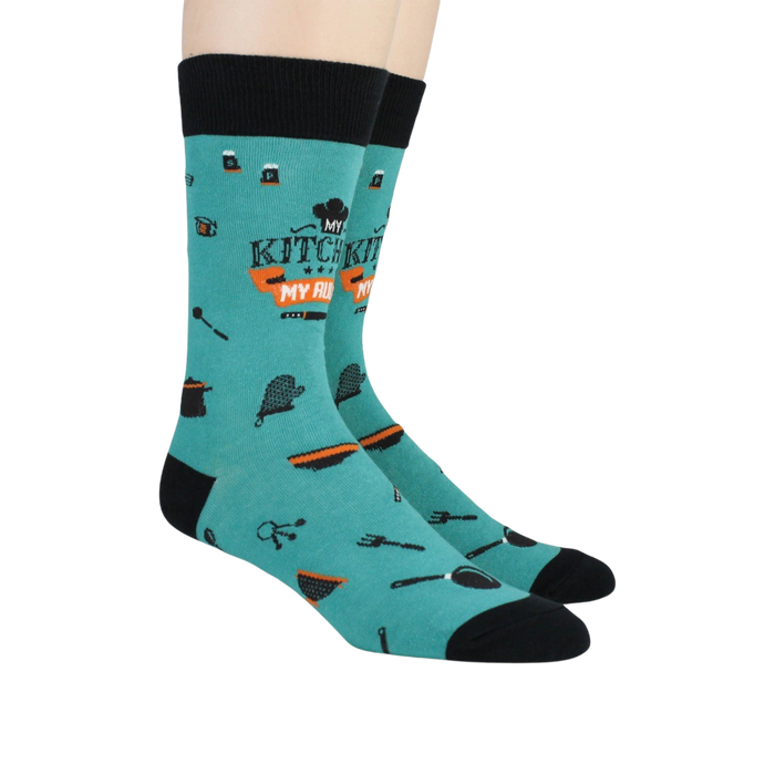 Lifestyle shot: Two people wearing teal 'My Kitchen My Rules' socks.