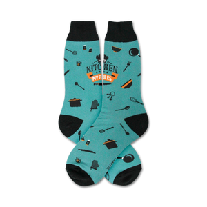Pair of teal crew socks with black cuffs.  Features orange text 'My Kitchen My Rules' and small kitchen utensil icons.