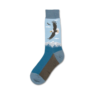 Single blue crew sock showcasing a detailed image of a bald eagle in flight over mountains.