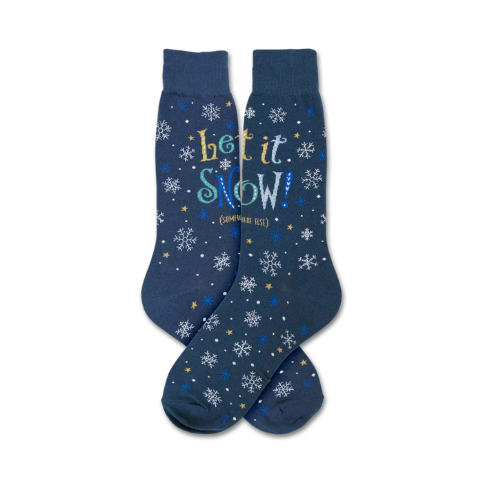 Pair of navy blue crew socks with a snowflake and 'Let It Snow' design in blue, white, and gold text.