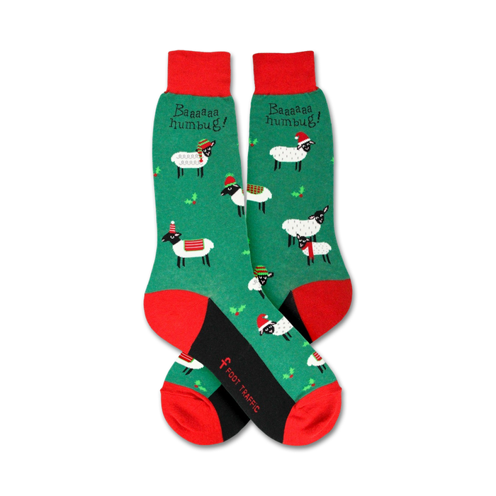 Flatlay showcasing a pair of green Christmas sheep socks with red and black accents.