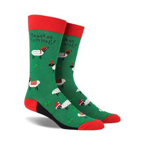 Pair of crew socks; green background with festive sheep wearing Santa hats; red and black accents; 'Baaaa humbug!' text.