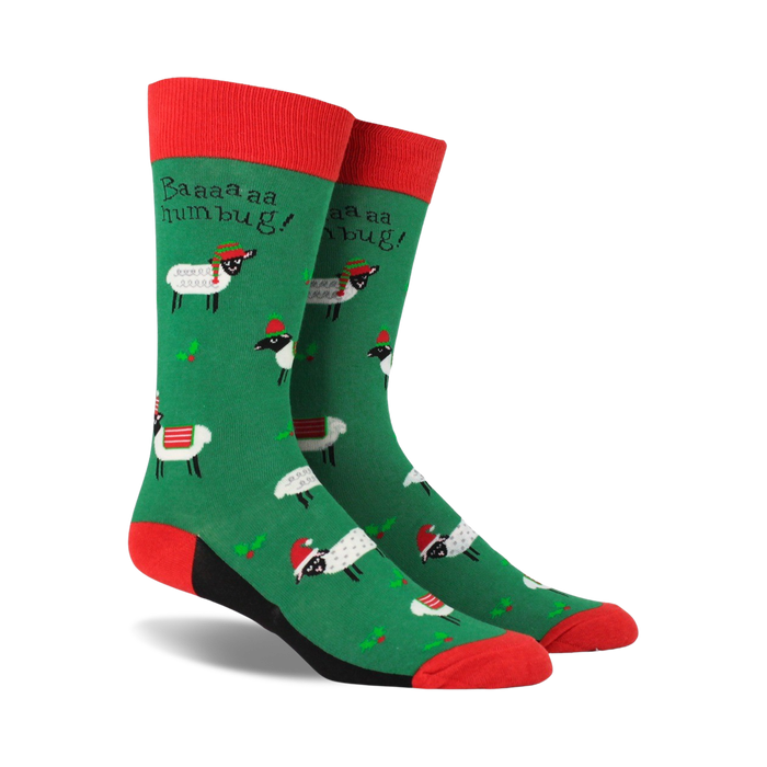 green novelty crew socks with white sheep in red santa hats, red cuffs, black heels, and toes. text: 'baaa...humbug!'  