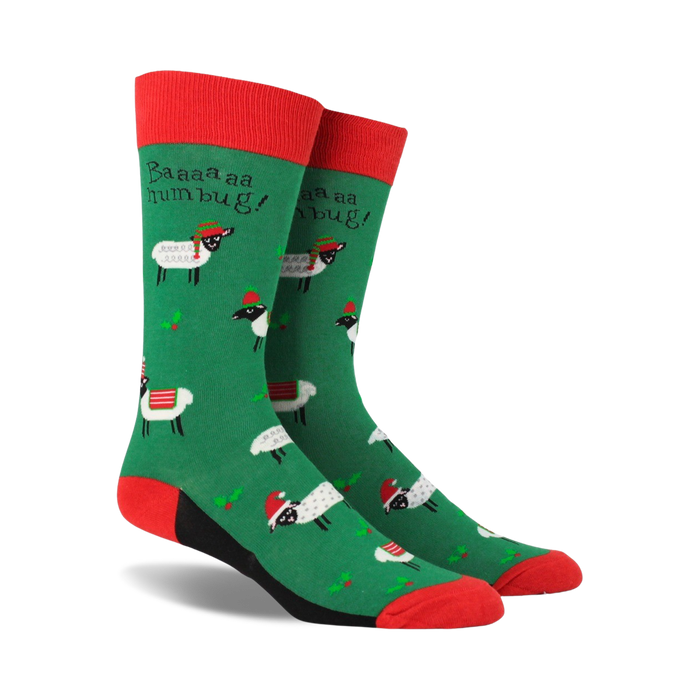 Pair of crew socks; green background with festive sheep wearing Santa hats; red and black accents; 'Baaaa humbug!' text.