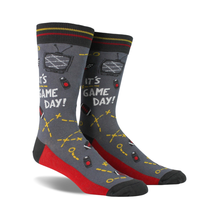 Pair of crew socks in gray, red, and navy blue. Design includes retro TV, game controllers, and the text 'It's Game Day!'